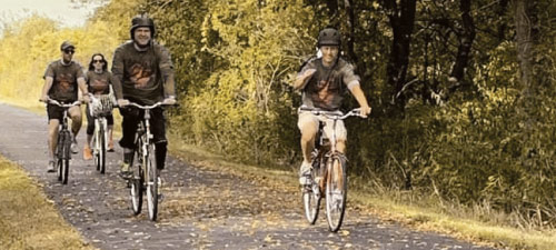 Cyclists riding on a Bike Path in the autumn season.